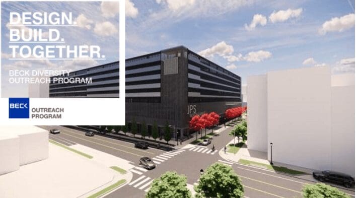 Modern black office building with landscaped surroundings and clear skies.