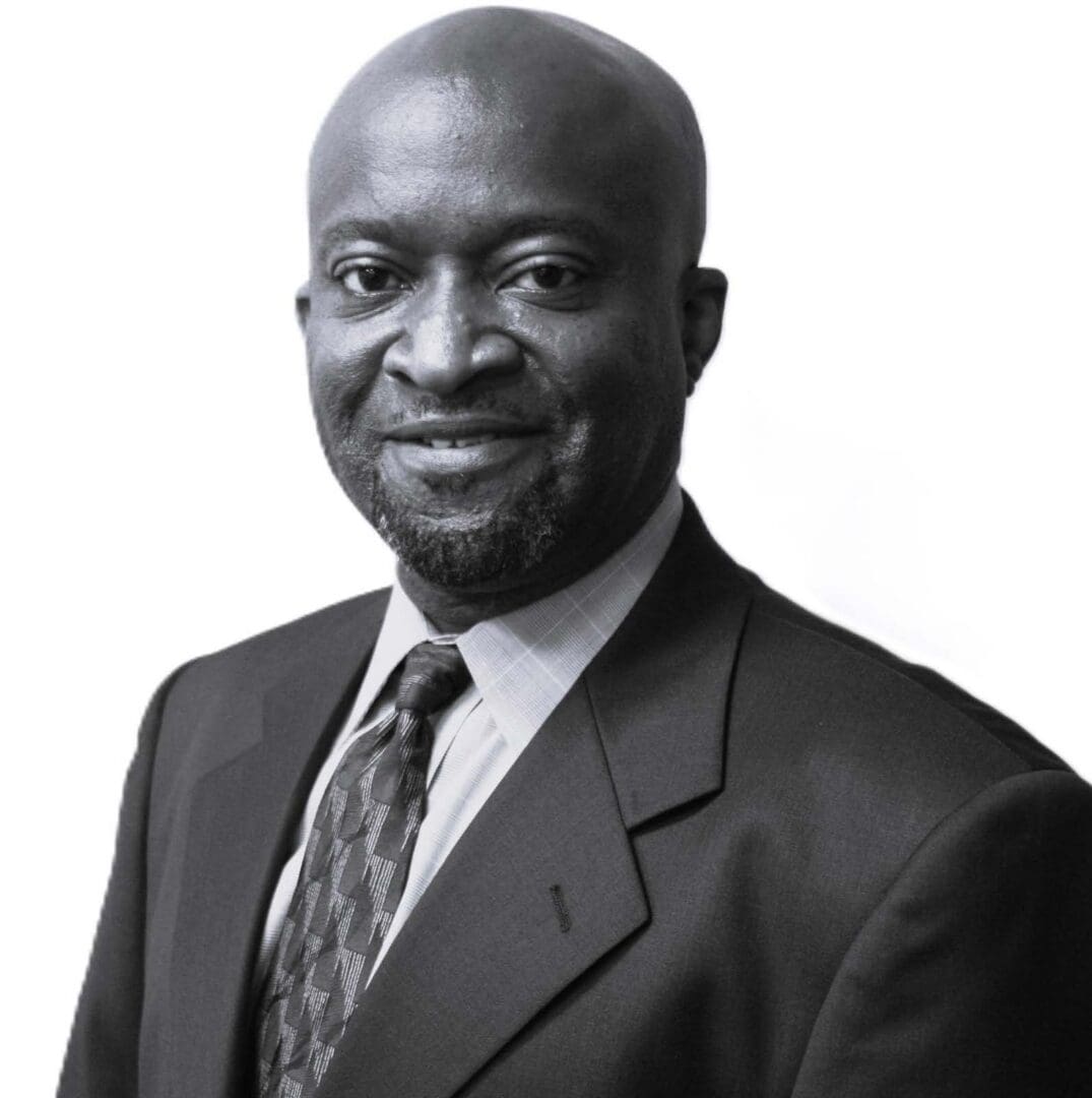 Smiling businessman wearing suit and patterned tie